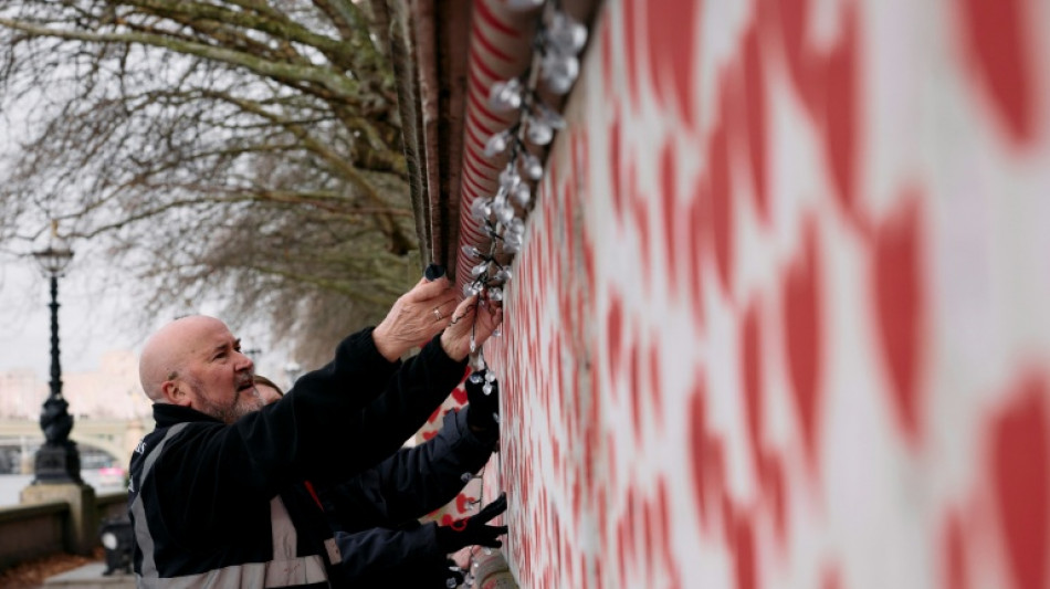 London wall illuminates Covid's enduring pain at Christmas