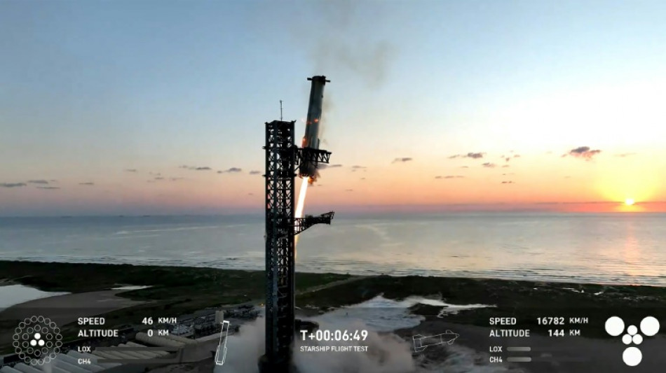 In a first, SpaceX 'catches' megarocket booster after test flight
