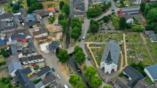 Flood anniversary prompts sadness and soul-searching in Germany