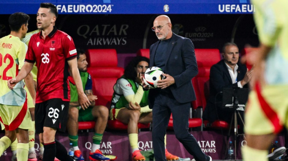 Deutsche Tageszeitung Spain coach urges exciting team to keep feet on