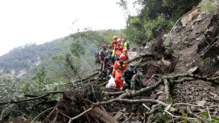 Downpours and mudslides hamper China earthquake rescue mission